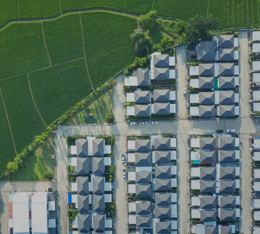Green sustainable subdivisions close to an agricultural field