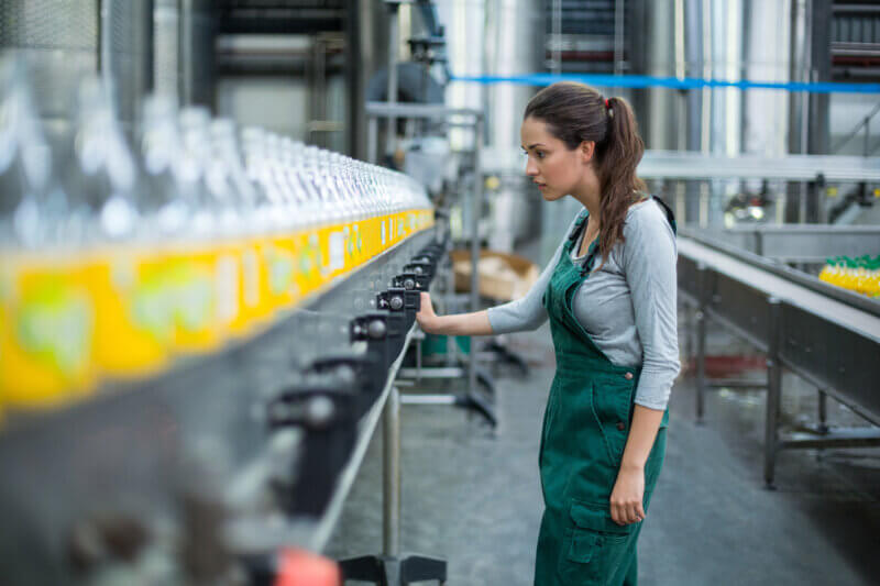 image of woman in beverage factory sustainable supply chain concept