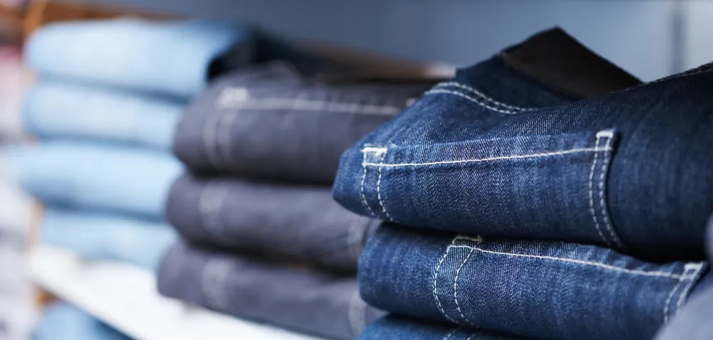 Shelf with jeans for sustainable retail and apparel